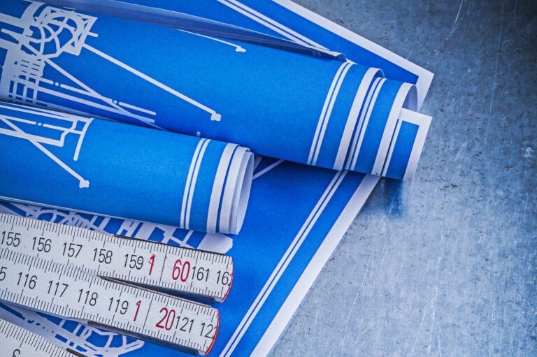 blue-construction-drawings-wooden-meter-on-metalli-2026-01-11-09-29-26-utc